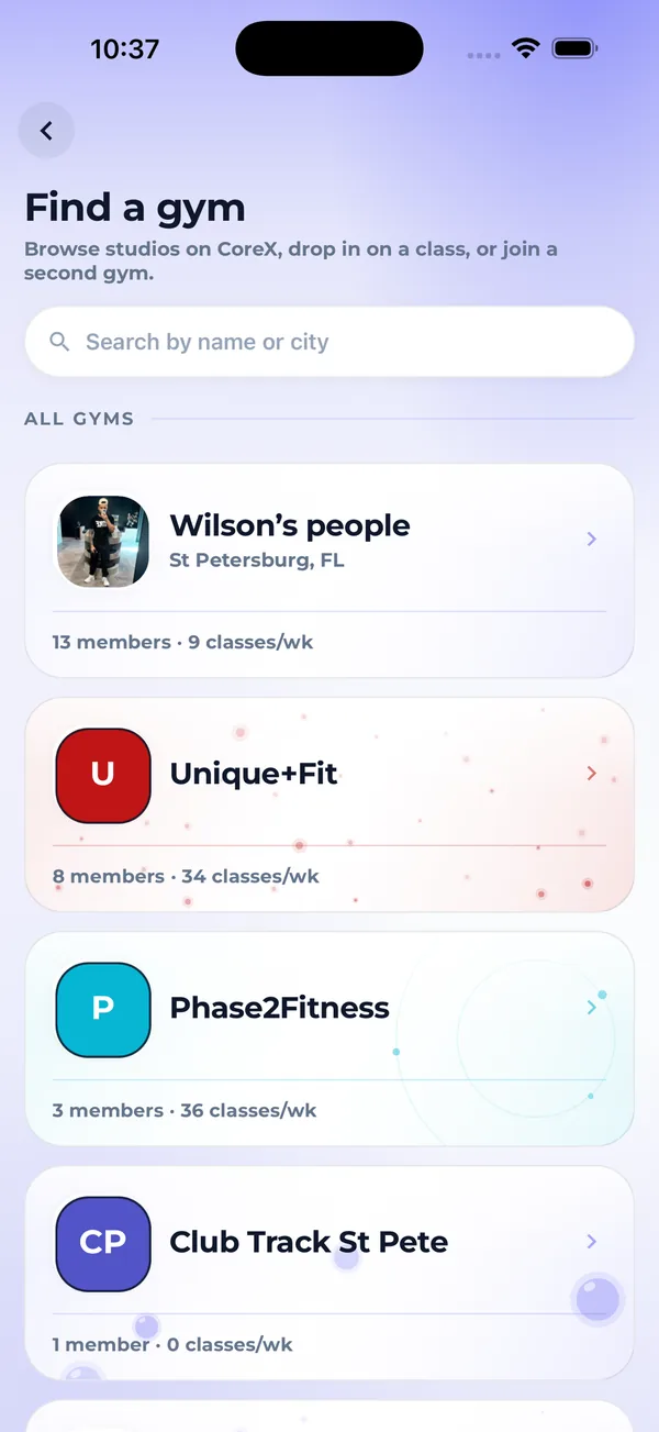 Core.X app Find a gym screen listing studios on Core.X with member counts and classes per week