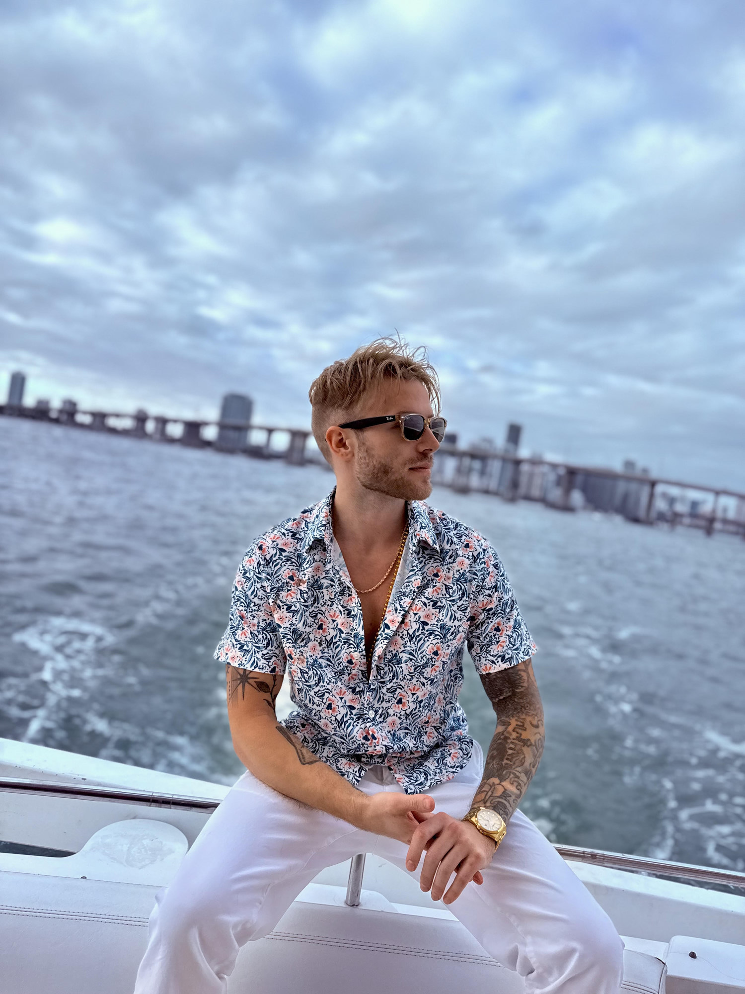 Wilson Ramstead, founder of Wilson Innovations, on a boat with the Miami skyline behind him.