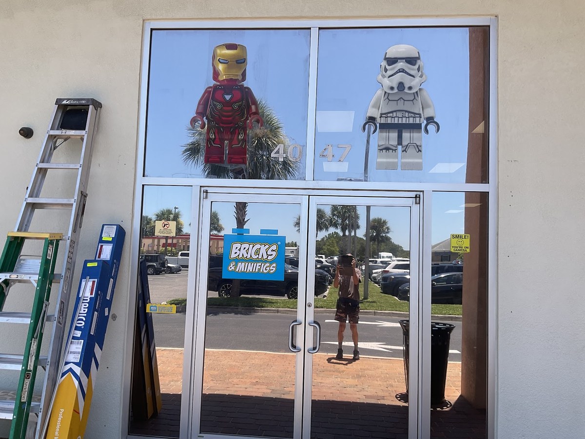 Storefront windows with custom cut decorative window film and graphics